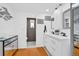 Bright bathroom with stylish mirrors, double sinks, and access to the toilet room at 1401 W Highway 50 # 45, Clermont, FL 34711