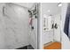 Bathroom with marble walk-in shower, modern fixtures, and sleek vanity at 1401 W Highway 50 # 45, Clermont, FL 34711