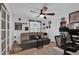 Cozy bedroom with a ceiling fan, pull out couch and desk setup at 1401 W Highway 50 # 45, Clermont, FL 34711
