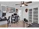 Bright bedroom with white walls, ceiling fan, closet, and desk with computer setup at 1401 W Highway 50 # 45, Clermont, FL 34711