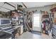 Cluttered garage workspace with a work desk, tools, and storage space near the garage door at 1401 W Highway 50 # 45, Clermont, FL 34711