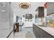Bright kitchen with dark cabinetry, granite countertops, and stainless steel refrigerator at 1401 W Highway 50 # 45, Clermont, FL 34711