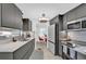 Modern kitchen with sleek cabinetry, stainless steel appliances, and breakfast nook at 1401 W Highway 50 # 45, Clermont, FL 34711