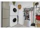 Laundry room featuring stacked washer and dryer units with additional storage cabinets at 1401 W Highway 50 # 45, Clermont, FL 34711
