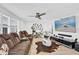 Inviting living room with hardwood floors, a ceiling fan, and comfortable seating arrangements at 1401 W Highway 50 # 45, Clermont, FL 34711