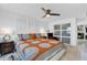 Relaxing bedroom with a ceiling fan, custom headboard and side tables at 1401 W Highway 50 # 45, Clermont, FL 34711