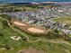 An aerial view of a golf course community with lush greens and single Gathering homes at 15580 Blackbead St, Winter Garden, FL 34787