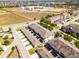 Aerial view of townhomes with garage driveways and community amenities at 15580 Blackbead St, Winter Garden, FL 34787