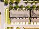 Birds eye view of the community featuring modern townhomes, sidewalks, and manicured lawns for a contemporary living experience at 15580 Blackbead St, Winter Garden, FL 34787