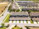 Beautiful aerial view of townhomes, garages, and a tranquil lake in a well-planned neighborhood at 15580 Blackbead St, Winter Garden, FL 34787