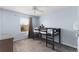 Charming bedroom with light blue walls, neutral carpet, a ceiling fan, and a loft bed by a window at 15580 Blackbead St, Winter Garden, FL 34787