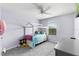 This bedroom has a whimsical bed frame, a large window, and ample space for furniture at 15580 Blackbead St, Winter Garden, FL 34787