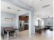 Open floor plan featuring dining area with modern lighting, kitchen, and living space at 15580 Blackbead St, Winter Garden, FL 34787