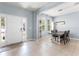 Open dining area with natural light, modern decor, and tile flooring at 15580 Blackbead St, Winter Garden, FL 34787