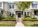 Inviting townhouse with well-manicured landscaping and charming front porch at 15580 Blackbead St, Winter Garden, FL 34787