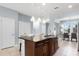 Spacious kitchen with island, granite countertops, and stainless steel appliances at 15580 Blackbead St, Winter Garden, FL 34787