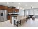 Bright kitchen with stainless steel appliances, a spacious island, and open floor plan at 15580 Blackbead St, Winter Garden, FL 34787