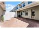 Private brick patio with white fence, perfect for outdoor relaxing at 15580 Blackbead St, Winter Garden, FL 34787