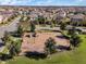 Aerial view of a neighborhood playground with mature trees, swings, and a slide in a residential area at 15580 Blackbead St, Winter Garden, FL 34787
