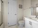 Cozy bathroom with white fixtures including a toilet, sink, and walk-in shower at 161 Orange Cosmos Blvd, Davenport, FL 33837