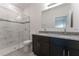 Modern bathroom featuring a glass-enclosed shower, dual-sink vanity, and granite countertops at 16947 Sw 22Nd Terrace Rd, Ocala, FL 34473