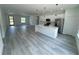 Open concept kitchen features stainless appliances, a center island, and light gray flooring at 16947 Sw 22Nd Terrace Rd, Ocala, FL 34473