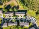 Aerial view of townhome community displaying ample parking and green spaces at 1968 Compass Flower Way, Ocoee, FL 34761