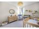 Bright Bedroom with a crib, dresser, rocking chair, and soft lighting for a cozy atmosphere at 1968 Compass Flower Way, Ocoee, FL 34761
