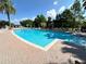 Resort-style pool with lounge seating and shade structures provides a relaxing retreat at 1968 Compass Flower Way, Ocoee, FL 34761