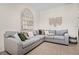 Comfortable living room with sectional sofa, decorative mirror, and stylish decor accents at 1968 Compass Flower Way, Ocoee, FL 34761