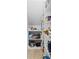 Organized pantry with adjustable shelving, offering ample storage for groceries and household supplies at 1968 Compass Flower Way, Ocoee, FL 34761