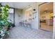 Covered patio with patterned tile, comfortable seating, and lush plants offering a relaxing outdoor space at 1968 Compass Flower Way, Ocoee, FL 34761