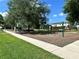 Community playground with swing set, slide, and benches in a park-like setting at 1968 Compass Flower Way, Ocoee, FL 34761