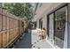 Inviting back deck with a dining table, a garden wall with plants, and string lights, ready for entertaining at 204 Smokerise Blvd, Longwood, FL 32779