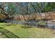 Beautiful tiered backyard featuring retaining walls with landscaping and lush green grass at 204 Smokerise Blvd, Longwood, FL 32779