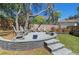 Cozy backyard patio with stone pavers and comfortable seating, perfect for outdoor relaxation at 204 Smokerise Blvd, Longwood, FL 32779