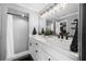 Modern bathroom features a double sink vanity, sleek black fixtures, and a walk-in shower at 204 Smokerise Blvd, Longwood, FL 32779