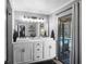 Stylish bathroom boasting a double sink vanity, modern fixtures, and a view of the backyard pool at 204 Smokerise Blvd, Longwood, FL 32779