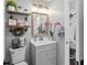 Cozy bathroom featuring rustic shelves, a decorative mirror, and modern decor at 204 Smokerise Blvd, Longwood, FL 32779