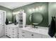 Charming bathroom with dual vanities, round mirrors, updated fixtures, and built-in shelving at 204 Smokerise Blvd, Longwood, FL 32779