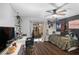 Bright bedroom with natural light, a ceiling fan, wooden floors, and a convenient workspace area at 204 Smokerise Blvd, Longwood, FL 32779