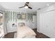 Cozy bedroom with closet space, laminate flooring, and a tranquil atmosphere enhanced by plants at 204 Smokerise Blvd, Longwood, FL 32779