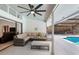 Relaxing covered patio with comfortable seating, views of the pool, and protection from the elements at 204 Smokerise Blvd, Longwood, FL 32779