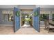 Bright foyer featuring tile flooring, a view of the front yard, and an open double-door entrance at 204 Smokerise Blvd, Longwood, FL 32779