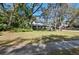 Traditional home with large front yard, mature trees, and neatly manicured landscaping showcasing curb appeal at 204 Smokerise Blvd, Longwood, FL 32779