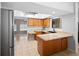 Open concept kitchen with stainless steel appliances, wood cabinets, and a skylight at 204 Smokerise Blvd, Longwood, FL 32779