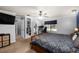 Spacious main bedroom featuring a ceiling fan, a workspace, and a closet for ample storage at 204 Smokerise Blvd, Longwood, FL 32779
