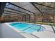 Screened in pool with a blue tiled pool with a deck and fenced in yard around the pool at 204 Smokerise Blvd, Longwood, FL 32779