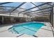 Screened in pool with a blue tiled pool and an outdoor living area with seating at 204 Smokerise Blvd, Longwood, FL 32779