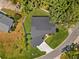 Aerial view showcasing the house and its manicured lawn in a lush, green neighborhood at 2058 Washington Ave, Sanford, FL 32771